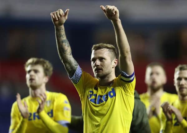 Leeds United's Liam Cooper salutes the fans after their win at Reading.