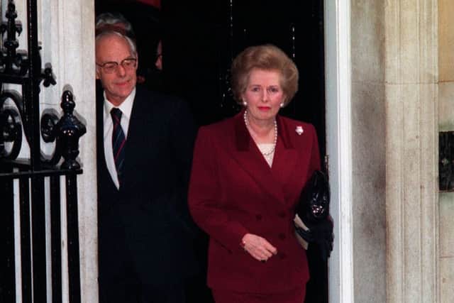 A teary-eyed Margaret Thatcher, and her husband Denis, leaving Downing Street for the final time in 1990.