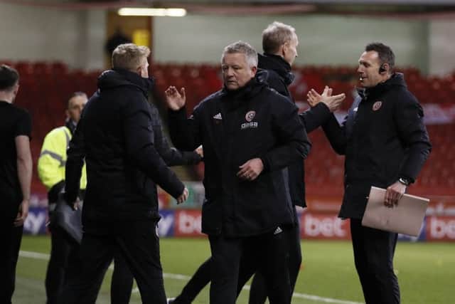 Job done: Sheffield United coaching staff led by Chris Wilder  celebrate the win. Picture: Simon Bellis/Sportimage
