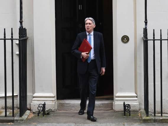 Chancellor Philip Hammond leaves 11 Downing Street as he heads to the House of Commons to deliver his Spring Statement. Credit: Stefan Rousseau/PA