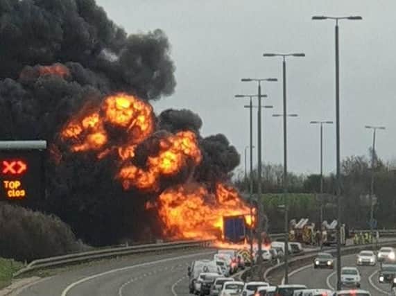 The fire has caused huge delays and a large amount of black smoke.