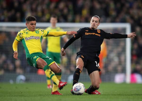 Hull City's Jackson Irvine, right, battles with Norwich City's Max Aarons at Carrow Road on Wednesday night (Picture: John Walton/PA Wire).