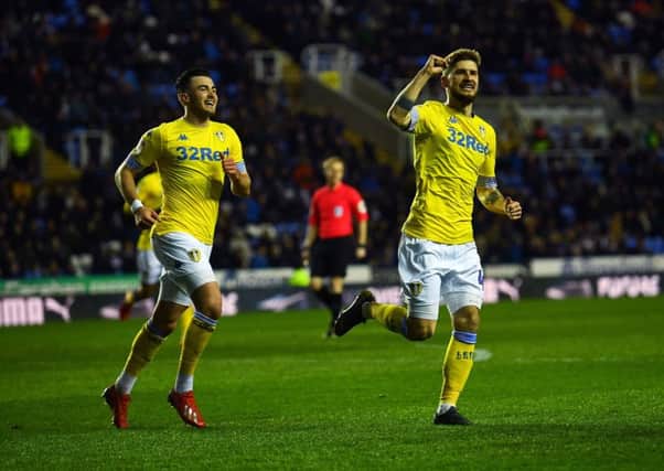 Mateusz Klich leaves Jack Harrison in his wake as he celebrates after scoring Leeds Uniteds opening goal in their comfortable 3-0 victory away to Reading on Tuesday (Picture: Jonathan Gawthorpe).