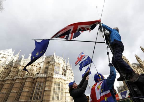 Anti-Brexit protesters outside Parliament in scenes that symbolise Britain's disunity.