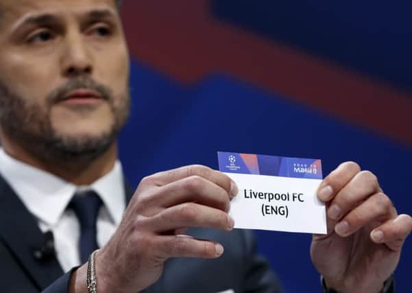 Former Brazilian soccer player Julio Cesar, ambassador for the UEFA Champions League, shows a ticket of England's club FC Liverpool, during the drawing of the matches for the Champions League 2018/19 quarter-finals at the UEFA headquarters in Nyon. (Salvatore Di Nolfi/Keystone via AP)