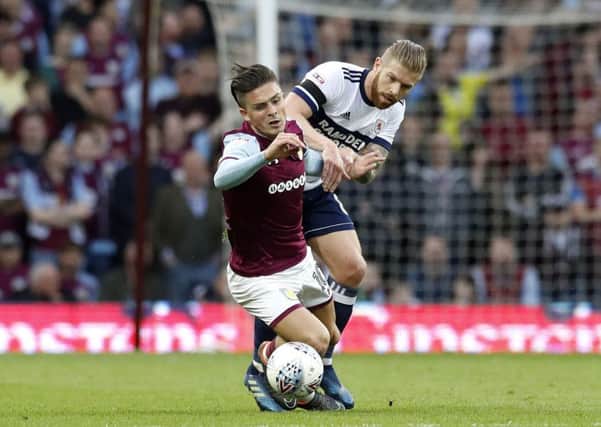 FAMILIAR FACE: Aston Villa's Jack Grealish (left) and Middlesbrough's Adam Clayton battle it out during last season's playoff semi-final, second leg. Picture: Martin Rickett/PA