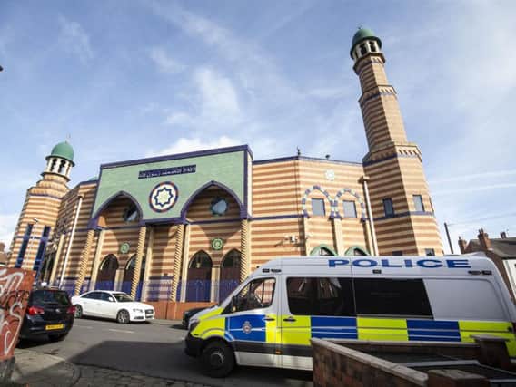 A police van parks outside Makkah Mosque in Leeds to reassure worshipers, following the Christchurch mosque attacks in New Zealand. (Danny Lawson / PA wire).