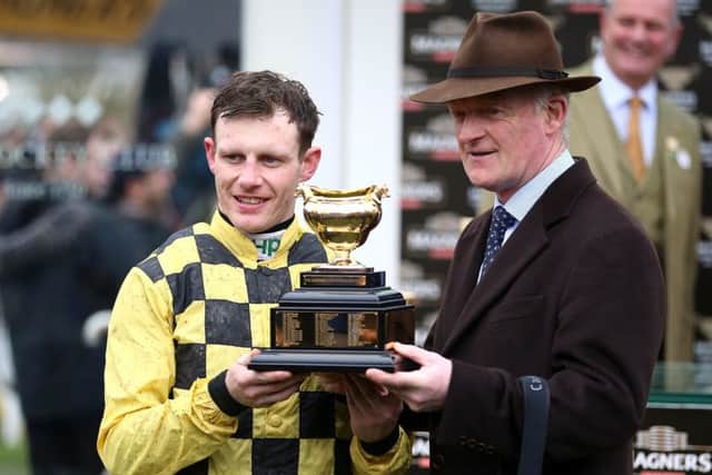 Jockey Paul Townend and trainer Willie Mullins celebrate the Gold Cup win of Al Boum Photo.