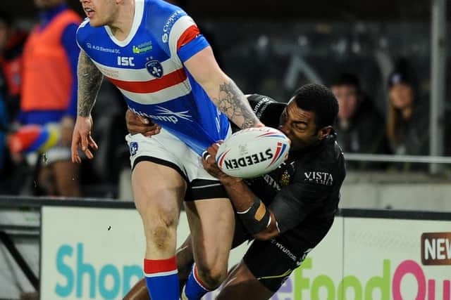 Wakefield's Tom Johnstone on the atack against Hull. (PIC: Dean Williams)