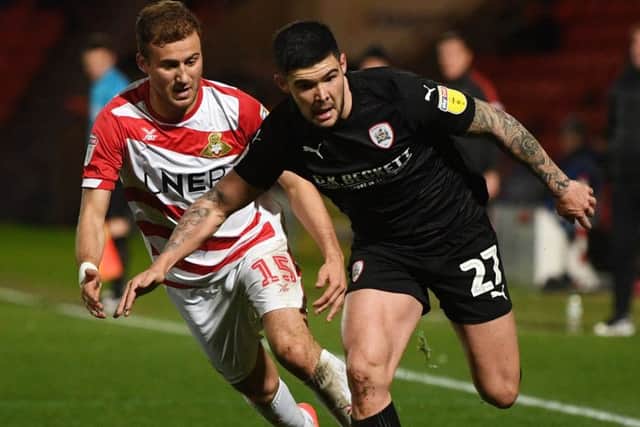 Barnsley's Alex Mowatt gets away from Doncaster's Herbie Kane.
(
Picture: Jonathan Gawthorpe)