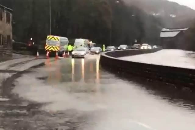 The A646 in Todmorden has been flooded by the River Calder.