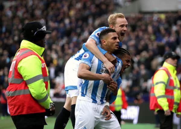 On target: Huddersfield Town's Karlan Grant celebrates scoring his side's third goal at the London Stadium.