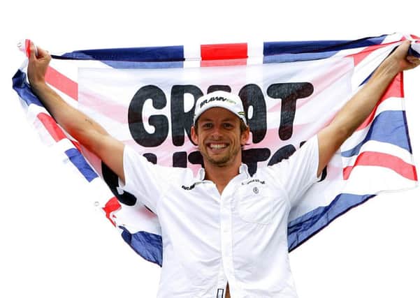 Champion: Brawn GP's Jenson Button celebrating after clinching the crown in Brazil in 2009.