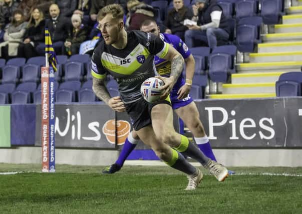 Tom Johnstone scores one of his three tries against Leeds Rhinos earlier this month. Picture by Isabel Pearce/SWpix.com.