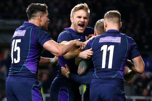 Scotland's Darcy Graham is mobbed by his team-mates after scoring his side's fourth try of the game during the Guinness Six Nations match at Twickenham Stadium, London. (Picture: Gareth Fuller/PA Wire)