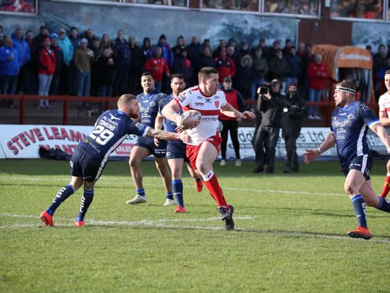 Hull KR captain Joel Tomkins goes around brother Sam to score a try in Rovers' 18-16 defeat against Catalans. (PIC: HULL KR)