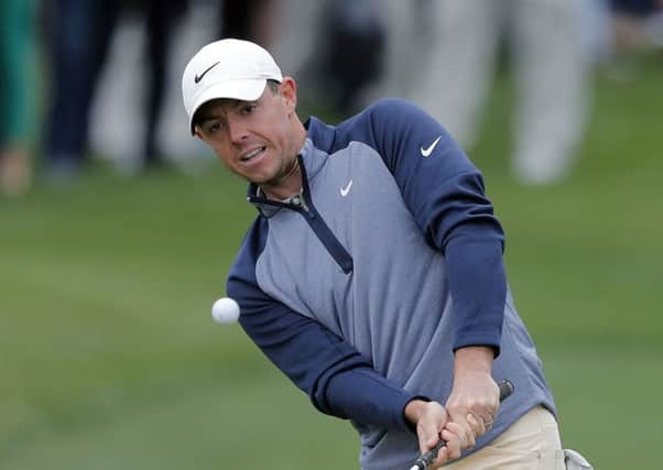 Rory McIlroy, of Northern Ireland, chips to the ninth green during the final round of The Players Championship. (AP Photo/Gerald Herbert)