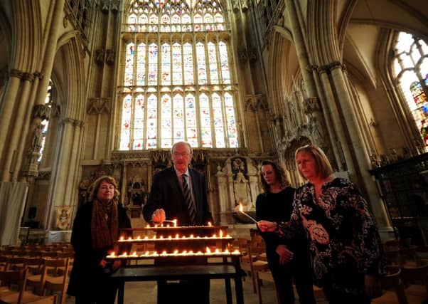 Friends of Claudia Lawrence light candles to mark the 10th anniversary of her going missing at York Minster. Pictured from the left to right are Hazel Dales, Martin Dales, Jen King and Suzy Cooper. Picture by Simon Hulme.
