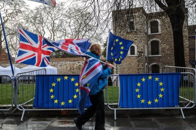 LONDON, ENGLAND - MARCH 18: Anti-Brexit protesters demonstrate outside the Houses of Parliament on March 18, 2019 in London, England. British Prime Minister Theresa May is attempting to persuade DUP and Conservative MPs to vote for her EU withdrawal agreement which has twice been heavily voted down by the House of Commons. (Photo by Jack Taylor/Getty Images)