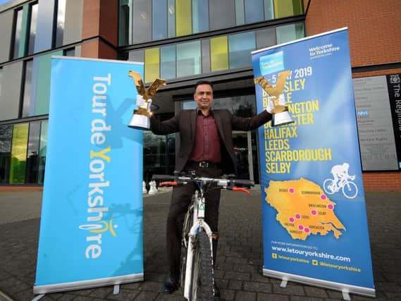 Coun Mohammed Rafique with Tour de Yorkshire trophies