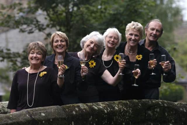 Calendar Girls Roz Fawcett, Angela Baker, Lynda Logan, Beryl, Bamforth, Tricia Stewart, and calendar photographer Terry Logan, celebrate reaching £1m for Leukeamia Research, after an anonymous donor  from the South of France topped up their total.  August 9, 2004.