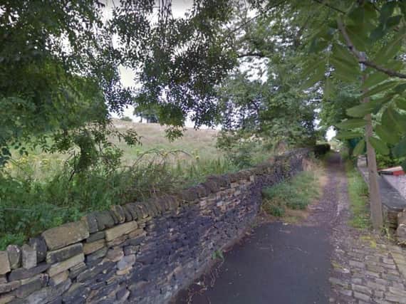 Two male suspects approached the victim, a 20-year-old man, after passing him on the footbridge on the Springfield footpath in Huddersfield.
