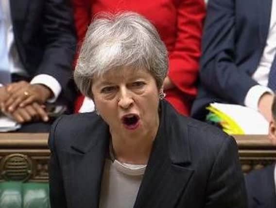 Theresa May speaks during Prime Minister's Questions in the House of Commons. Credit: House of Commons/PA Wire