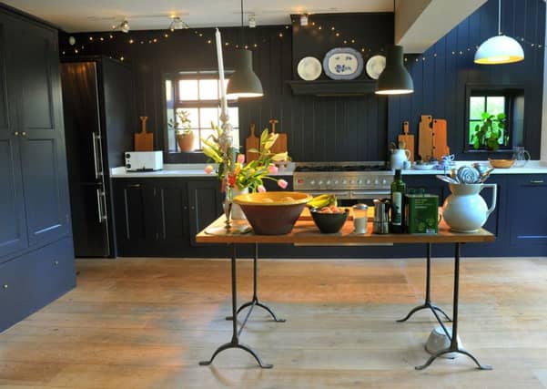 The kitchen cabinets were made by Michael and are painted in Valspar's "Evening Coat".