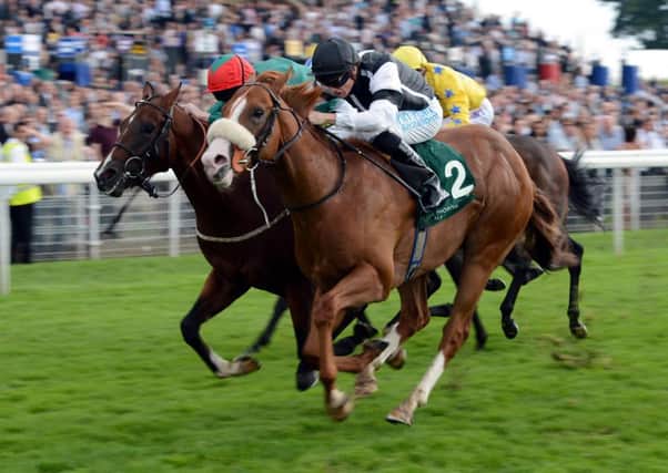 Phillip Makin, nearest camera, seen riding Blaine to victory in the Irish Thoroughbred Marketing Gimcrack Stakes at the 2012 Ebor Festival at York (Picture: John Giles/PA Wire).
