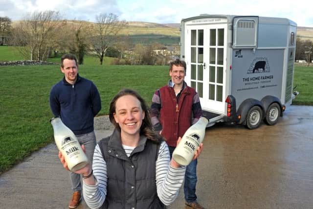 Aysgarth dairy farmers Ben, right, and Samantha Spence and Ben's brother Adam Spence, left,  have converted a horse box into a mobile shop containing a vending machine, from which customers can pour fresh whole milk into glass bottles.
The horsebox will be parked up at villages across Wensleydale. Picture Tony Johnson.