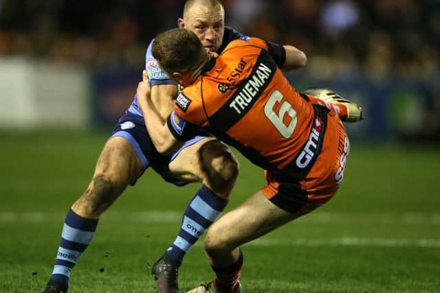 St Helens' James Roby sends Jordan Rankin flying. (Nigel French/PA Wire)