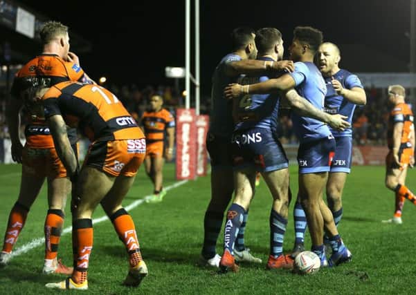 St Helens Mark Percival (fourth right) celabrates after scoring his side's sixth try against Castleford.