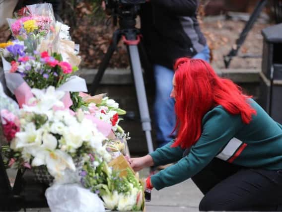 A bench where Libby Squire was last seen has become a focal point for floral tributes
