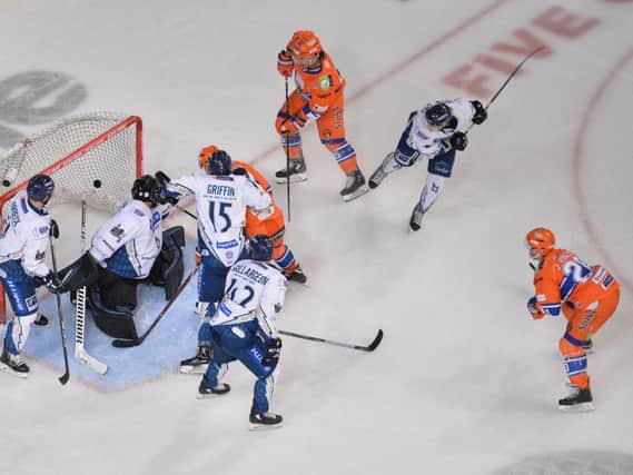 Jonathan Phillips, far right, fires home Sheffield Steelers' fifth  goal against Milton Keynes Lighntning on Saturday night. Picture: Dean Woolley.