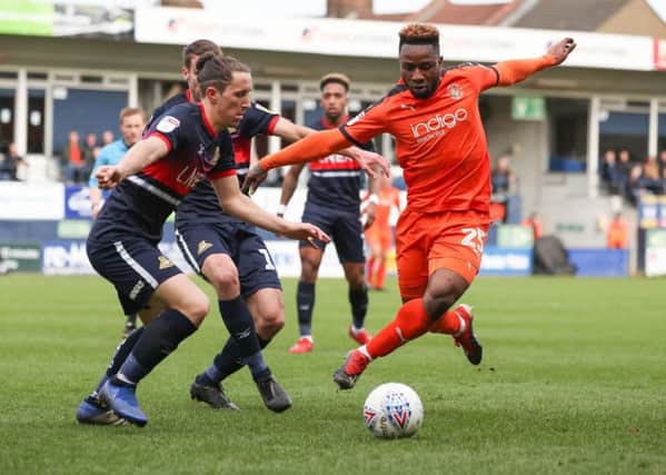 My ball: Luton Town's Kazenga LuaLua is challenged by Doncaster Rovers' Aaron Lewis.