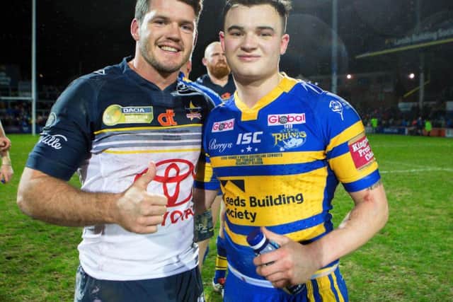 Lachlan Coote, left, with Leeds Rhinos' Jordan Lilley after winning the 2016 World Club Challenge with North Queensland Cowboys at Headingley. (SWPix)