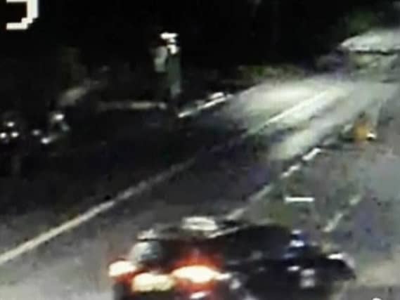 Police are searching for the driver of a black estate car who crashed into a man and then drove off.