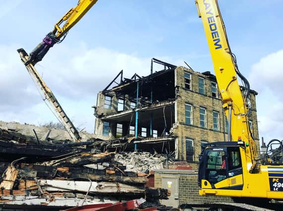 The severely damaged mill is now being demolished