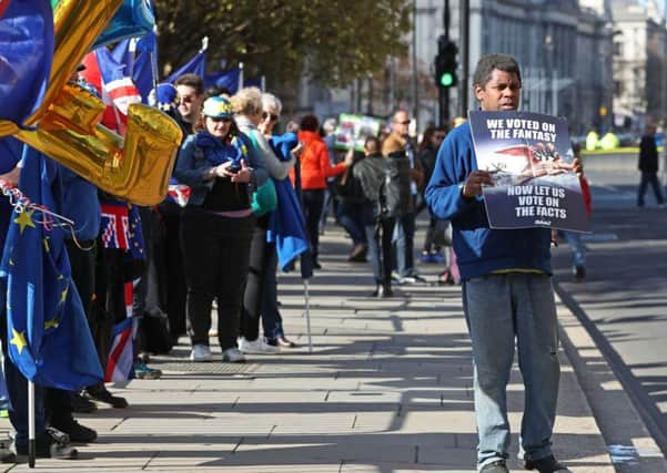 Anti-Brexit protestors line the streets outside Westminster in London. Pic: Jonathan Brady/PA Wire