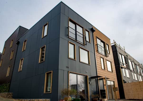 The houses are inspired by Scandinavian design and are timber-framed with composite cladding.
