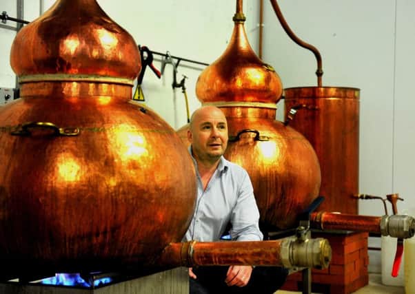 280219   Karl Mason Director and co-founder  of Masons Gin inbetween two of the Stills  at their plant in Bedale.