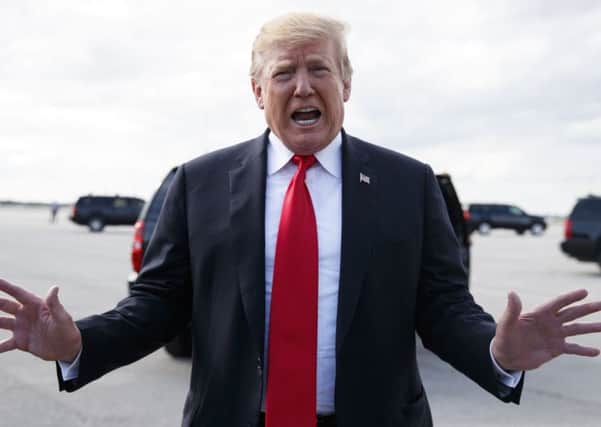 President Donald Trump has been the target of a 'crazy conspiracy theory', writes Bill Carmichael. (AP Photo/Carolyn Kaster)