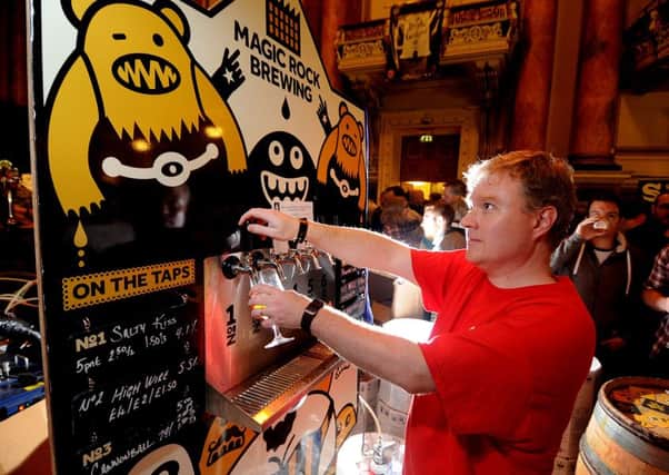 Date:6th September 2014, picture James Hardisty, (JH1005/04a) Leeds International Beer Festival held at Leeds Town Hall. Pictured Mike Wallis, pulling a pint of Salty Kiss on the Magic Rock stand.