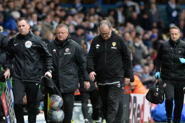 Chris Wilder and Marcelo Bielsa leave the pitch at half time during the recent derby at Elland Road.  Picture Bruce Rollinson