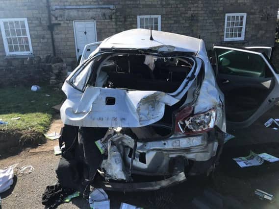 The damage to the car that crashed into a house.