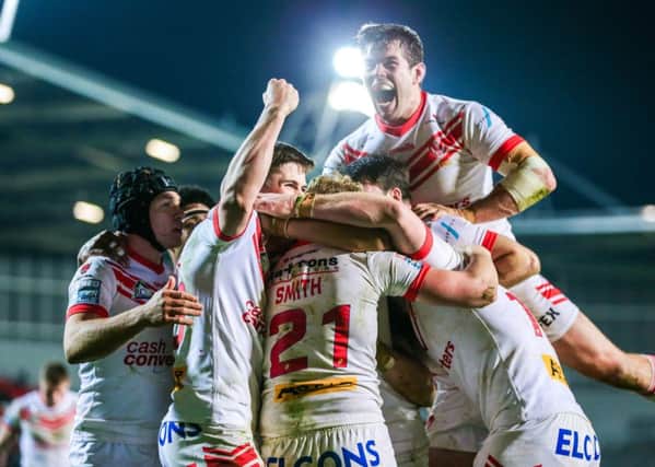 St Helens players celebrate Aaron Smith's try.