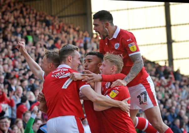 On target: Cauley Woodrow celebrates scoring Barnsley's second goal.  Picture: Bruce Rollinson