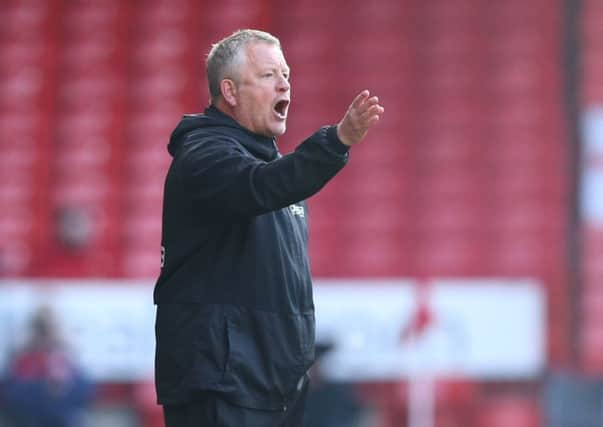 Blades chief Chris Wilder: Issuing instructions from the touchline.
