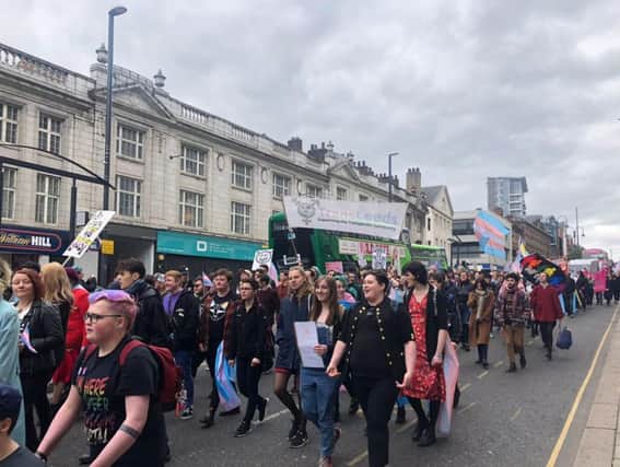 The trans community and allies march through Leeds city centre.