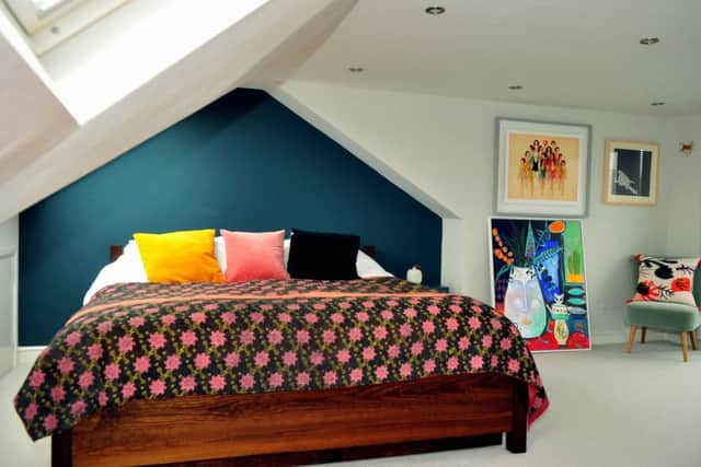The new loft conversion, which has created a large bedroom with ensuite bathroom. The painting on the floor is by Rosie and the one above is by Delphine Leborgeois.